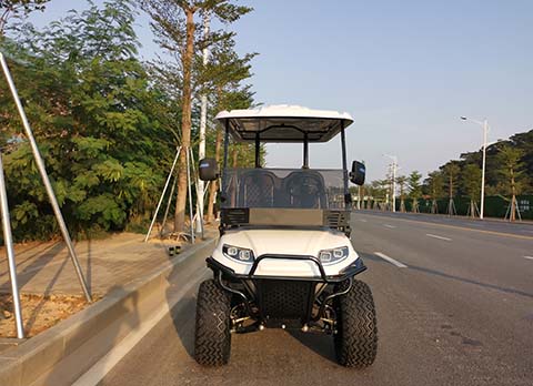 white lifted electric golf cart